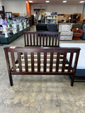 dark wooden full bedframe