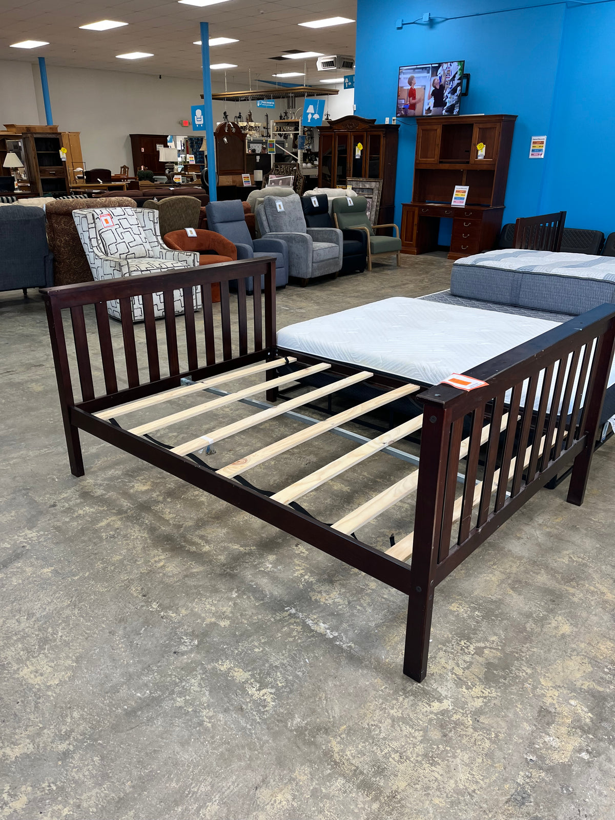dark wooden full bedframe